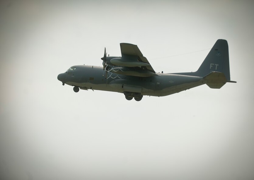 An HC-130P Combat King flies through the skies while waiting for Airmen from the 38th Rescue Squadron to jump at Moody Air Force Base, Ga., July 12, 2011. Two types of jumps were performed during the flyover, a tandem and free fall. (U.S. Air Force photo by Airman 1st Class Joshua Green/Released)
