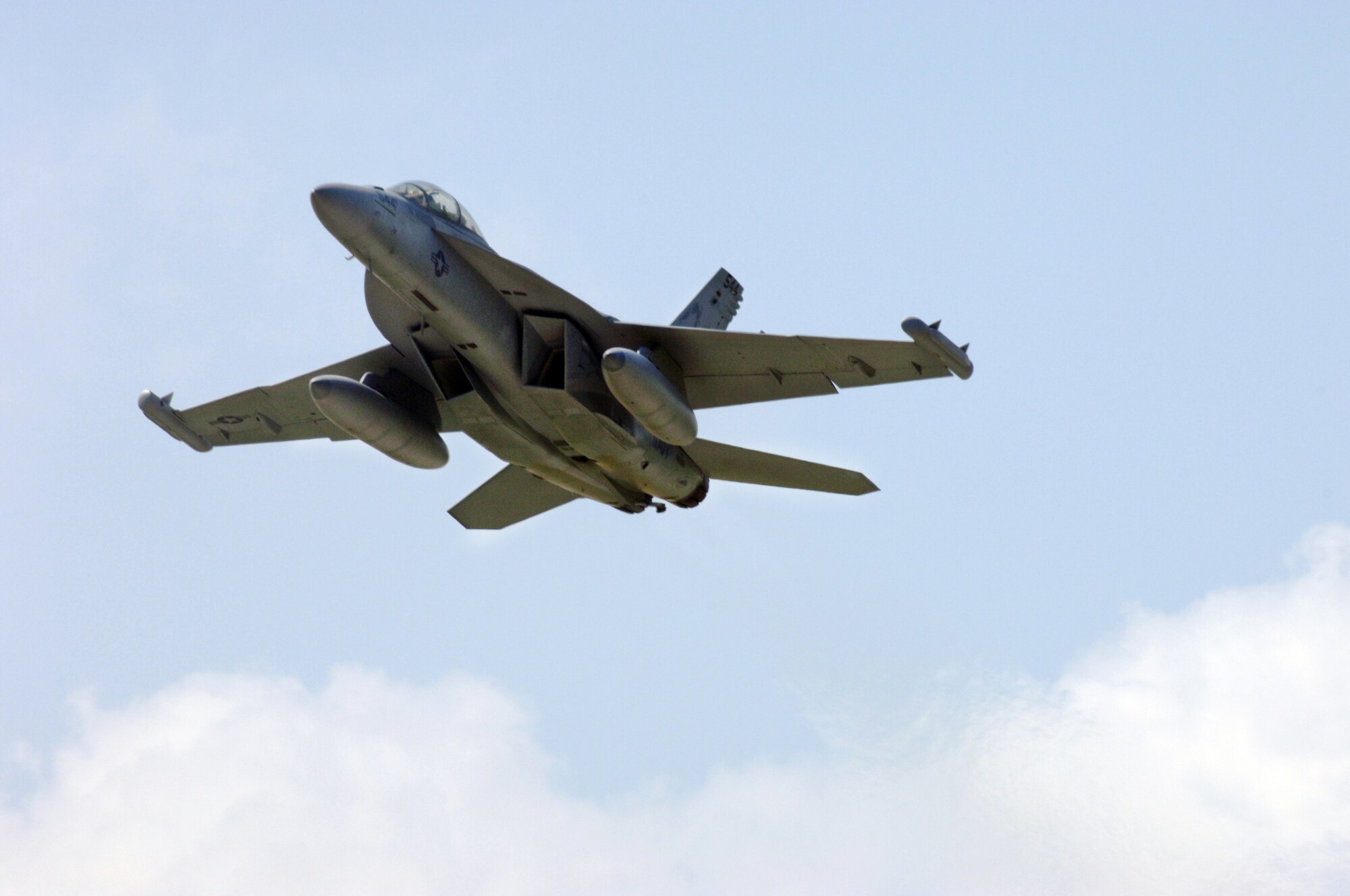 An EA-18G Growler assigned to Scorpions of Electronic Attack Squadron 132, takes off from Joint Base Andrews NAF Washington after completing an eight-month forward deployment in support of Operation Odyssey Dawn and Operation New Dawn.  The EA-18G Growler is the fourth major variant of the F/A-18 Hornet and is built to replace the EA-6B Prowler.  (U.S. Navy photo by Mass Communication Specialist 2nd Class Clifford L. H. Davis)