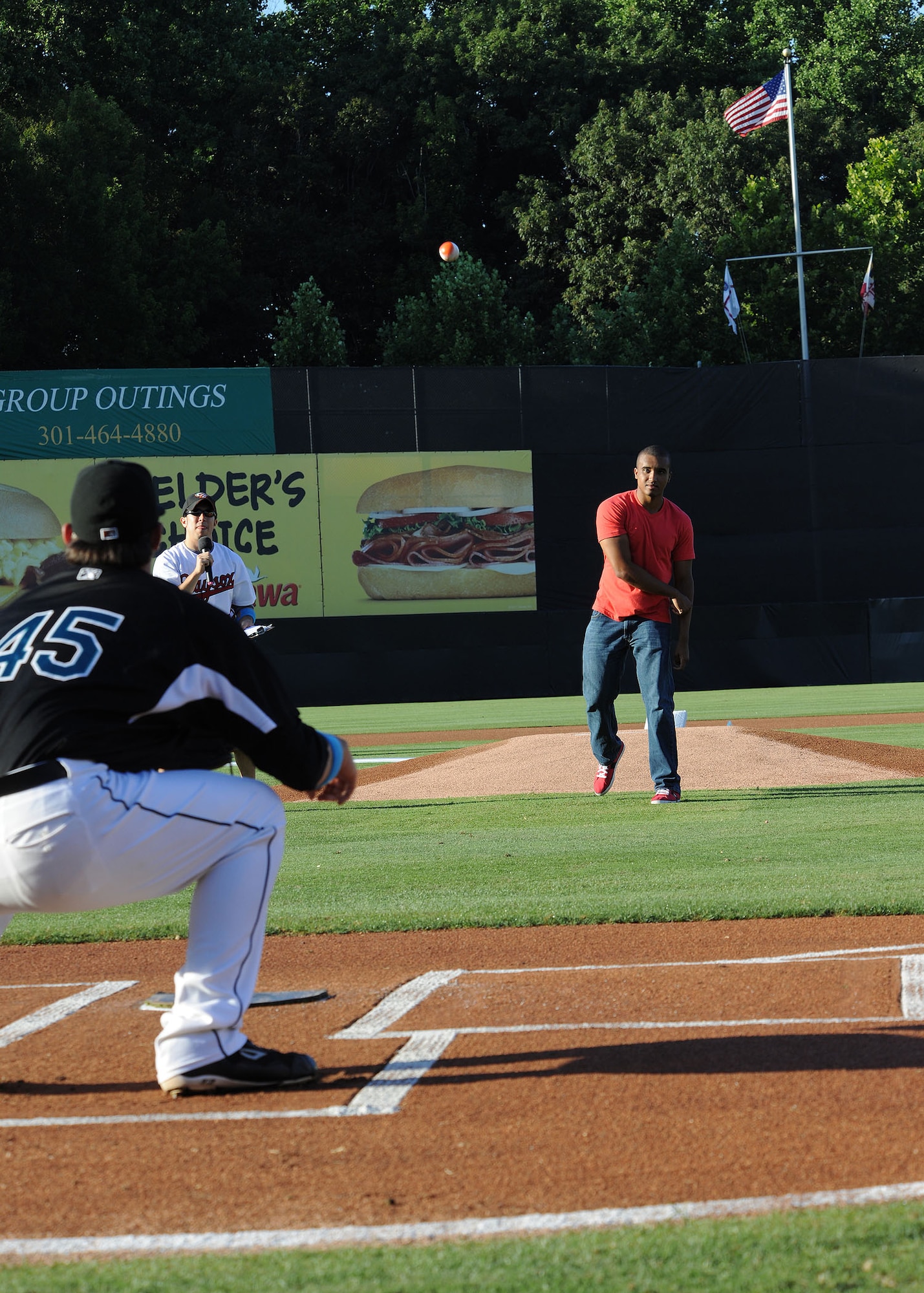 Airman 1st Class Maxim Hodges, 11th Wing Plans and Program client support administrator, throws out one of the first pitches of the Bowie Baysox baseball game against the Richmond Flying Squirrels at the Prince George's Stadium July 15. The Bowie Baysox hosted Joint Base Andrews night at their sporting event to show their appreciation for the military community. (U.S. Air Force photo/ Senior Airman Matt Coleman-Foster)