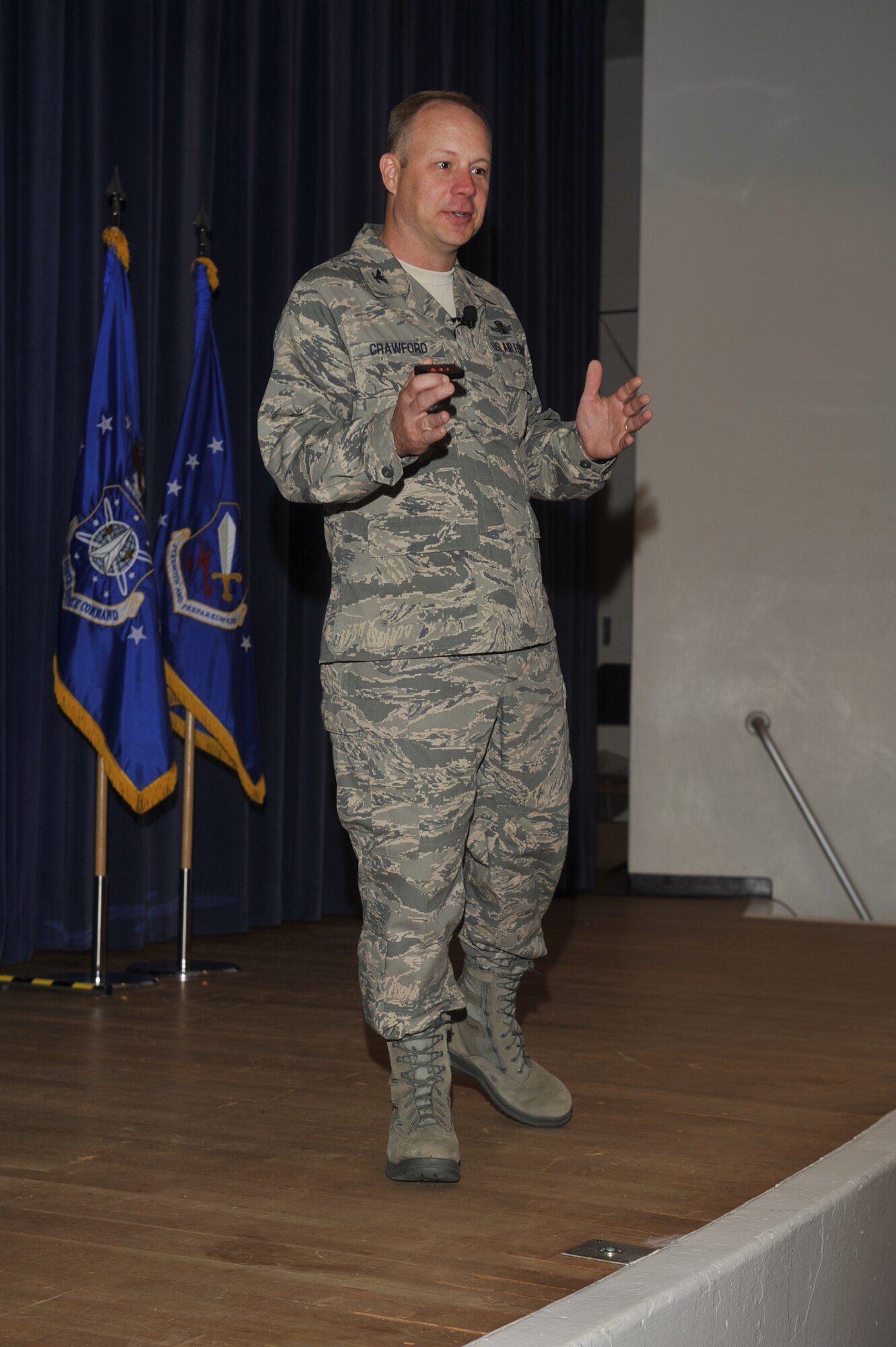 Col. Chris Crawford, 21st Space Wing commander, shares his vision and priorities with 21st Space Wing Airmen and civilians during his first commander’s call July 8, 2011 at the Peterson AFB auditorium. Crawford is no stranger to the 21st SW; he was the 21st Operations Group commander from 2007-2009, and has been stationed in Colorado Springs four times prior. (U.S. Air Force photo/Robb Lingley)