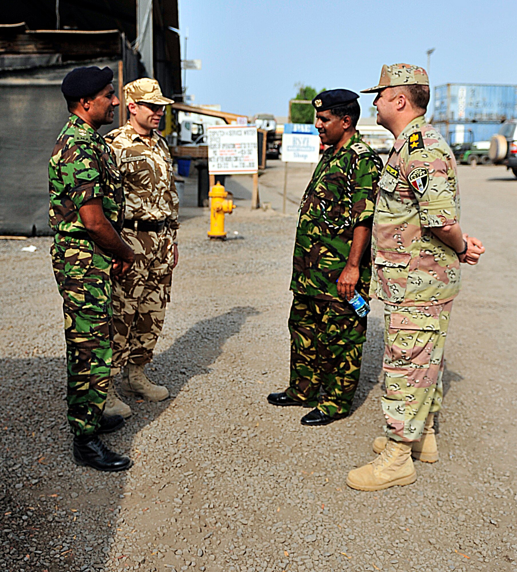 Kenyan Ministry of Defense Muslim Imam (Lt. Col.) Mohammed Ahmed (second from the right) meets with partner nation coalition officers from Combined Joint Task Force - Horn of Africa before visiting the Muslim prayer tent at Camp Lemonnier, Djibouti, July 5, 2011. Ahmed, along with two other Kenyan chaplains, traveled to Camp Lemonnier to receive U.S. professional military chaplaincy familiarization with CJTF-HOA chaplains. (U.S. Army photo/Specialist Michelle C. Lawrence)