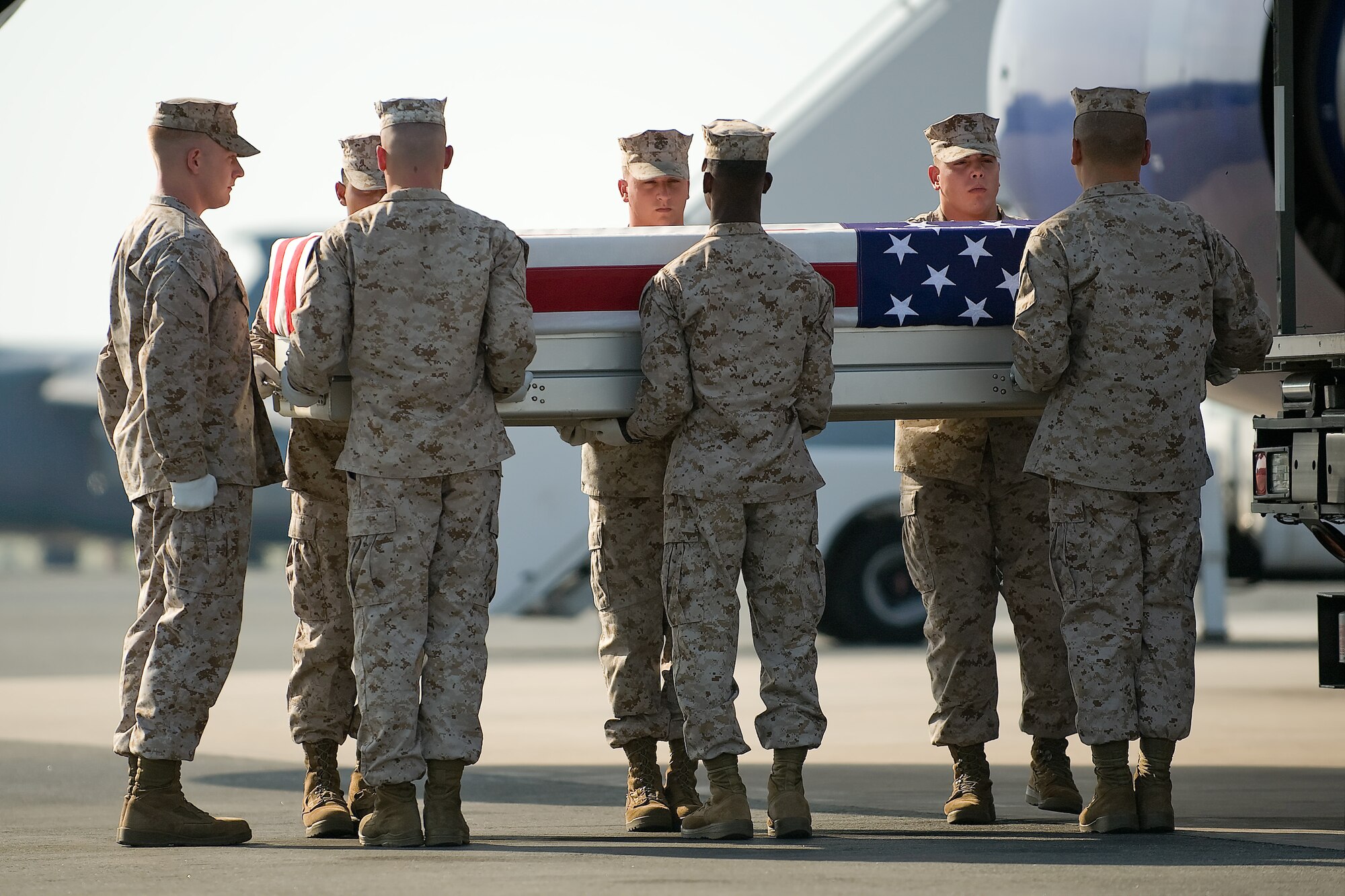 A U.S. Marine Corps carry team transfers the remains of Marine Lance Cpl. Jabari N. Thompson at Dover Air Force Base, Del., July 18, 2011. (U.S. Air Force photo/Steve Kotecki)