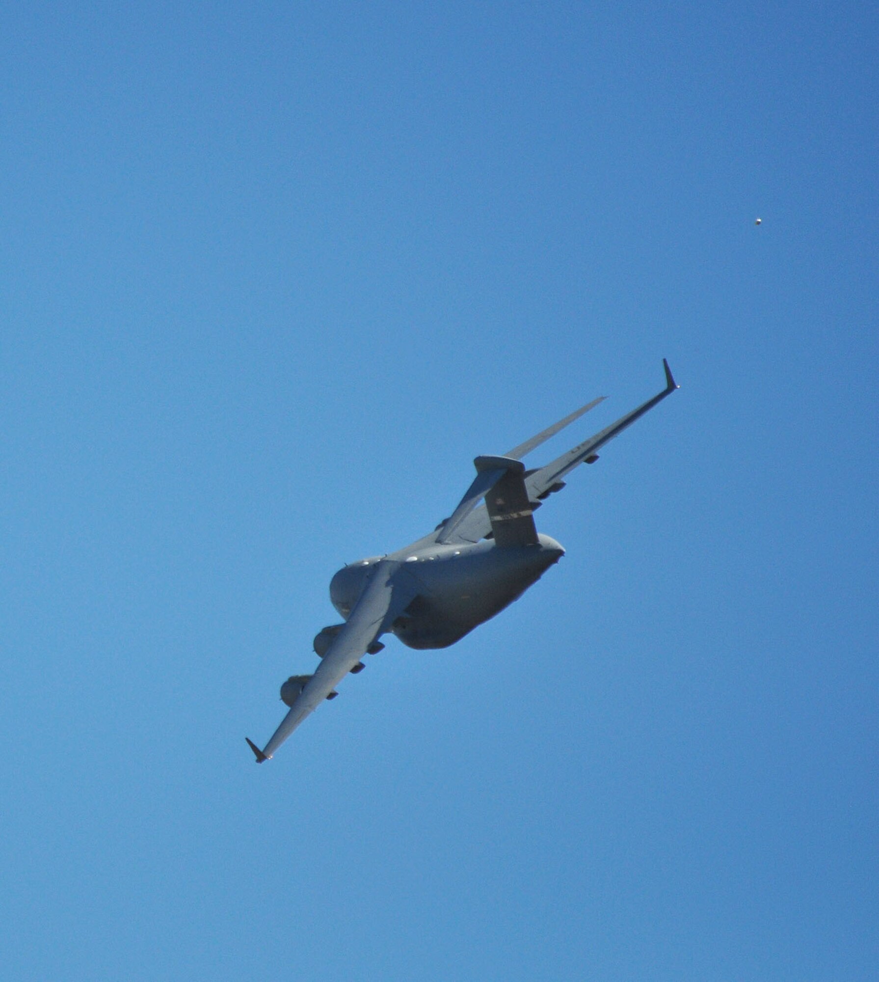 TRAVIS AIR FORCE BASE, Calif. -- Included in the festivities for the Sonoma Parade was a C-17 flyover flown by a Reserve crew from the 301st Airlift Wing. The flight path took them right down the tree-lined main street toward the historic town plaza, as they gracefullly banked away and over City Hall for another pass. (U.S. Air Force photo/Senior Master Sgt. Ellen L. Hatfield)