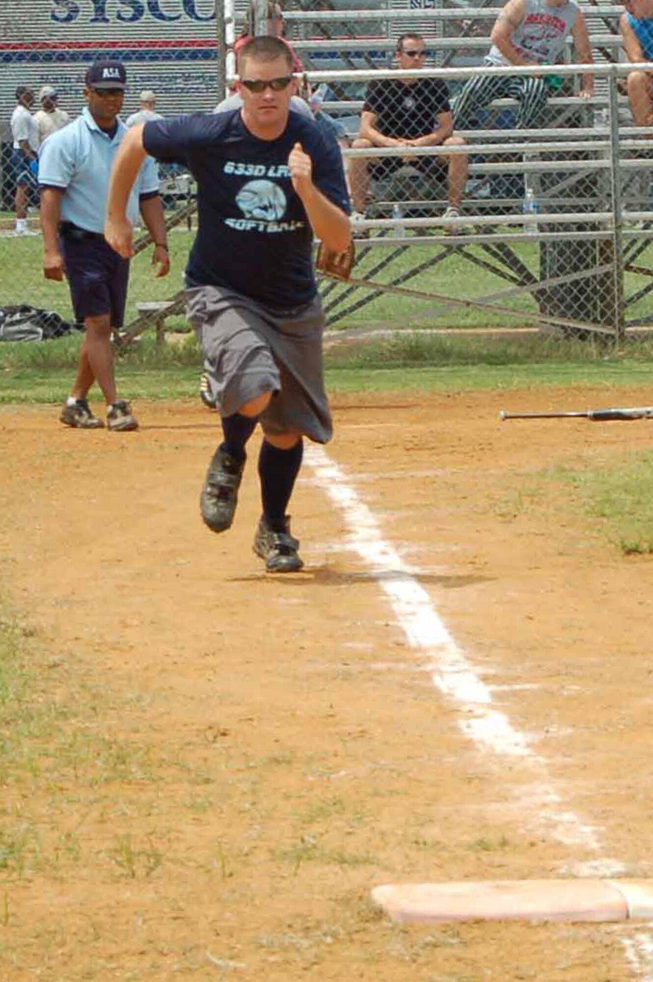 Staff Sgt. Stephen McKinley, 633rd Logistics Readiness Squadron vehicle operations dispatcher, makes a beeline for first base during a softball game against the 633rd Civil Engineer Squadron at Junior Enlisted Appreciation Day at Langley Air Force Base, Va., July 15, 2011.  Squadrons competed throughout the day during the annual event, hosted by the installation to provide food, fun and enjoyment for the hardworking junior enlisted ranks.  (U.S. Air Force photo by Senior Master Sgt. Anna Hayman/Released) 