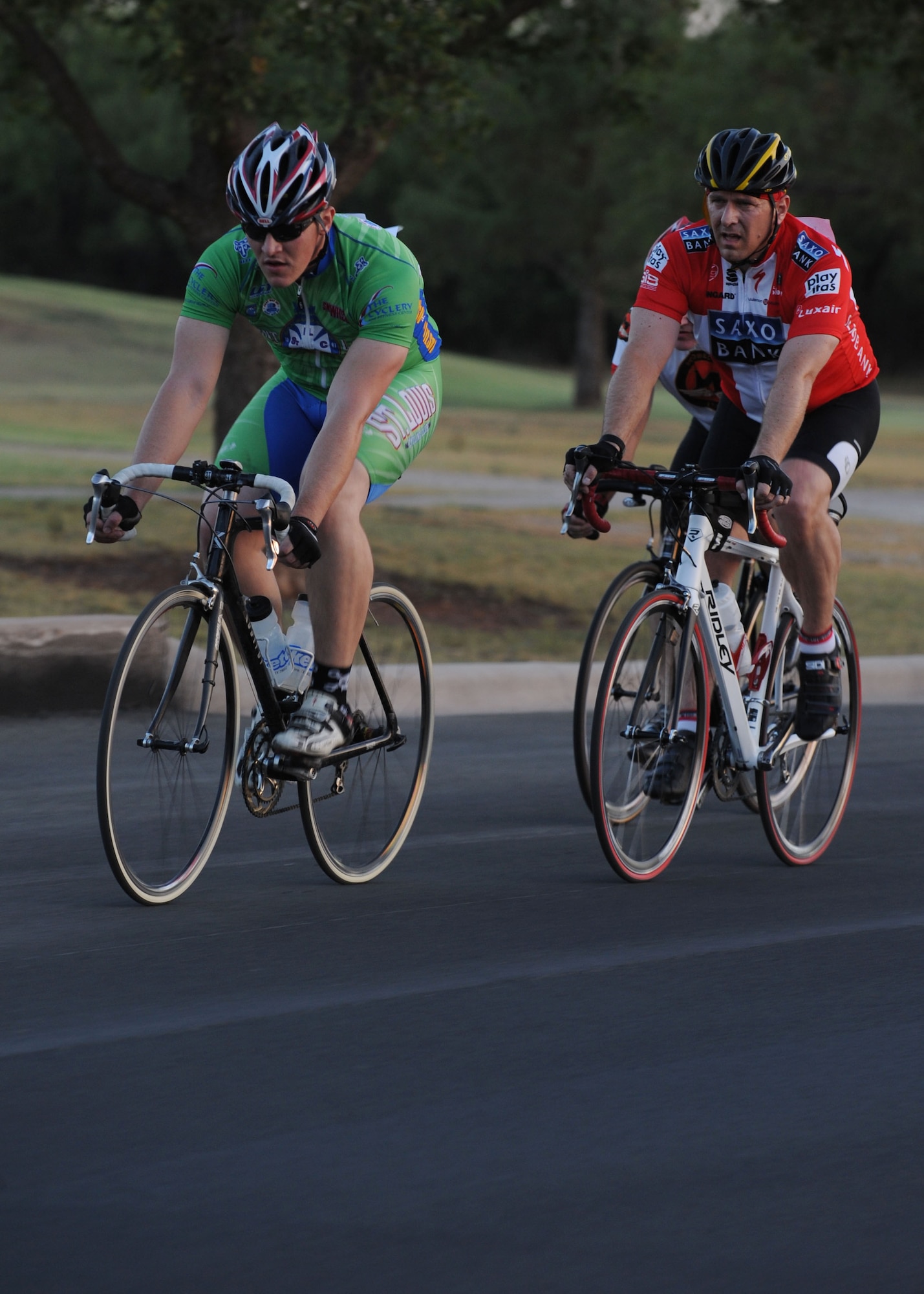 Dyess Air Force Base, Texas- Senior Airman Nick Erhard, 7th Force Support Squadron, keeps a steady lead with Major Graham Little, 7th Maintenance Operations Squadron commander, following close behind July 16, 2011. More than 50 cyclists of all abilities challenged themselves during the competitive event on a 26 mile course starting at the fitness center, trekking around the base. (U.S. Air Force photo by Airman 1st Class Jonathan Stefanko/Released) 