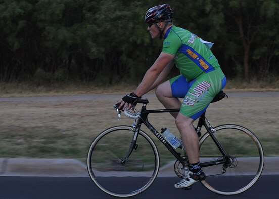 Dyess Air Force Base, Texas- Senior Airman Nick Erhard, 7th Force Support Squadron, keeps a steady pace as he approaches the end of his third lap of the Le Tour De Dyess here July 16, 2011. More than 50 cyclists challenged themselves during the 26 mile course that started at the fitness center and weaved throughout the base. (U.S. Air Force photo by Airman 1st Class Jonathan Stefanko/Released) 