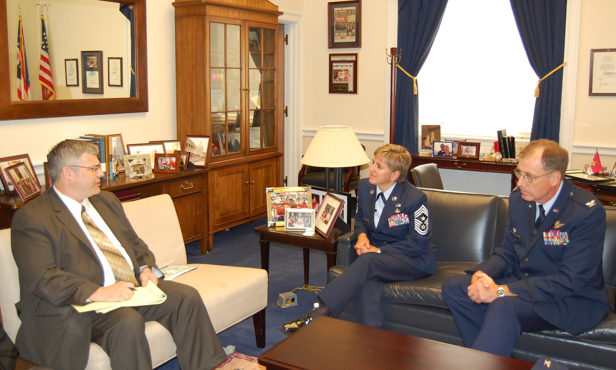 WRIGHT-PATTERSON AIR FORCE BASE, Ohio – Col. Stephen D. Goeman, 445th Airlift Wing commander, and Chief Master Sgt. Peri L. Rogowski, 445th Airlift Wing command chief, visit with Deputy Chief of Staff Richard D. (Dee) Weghorst, legislative director for U.S. Representative Jean Schmidt, July 13. Commanders meet annually with congressmen representing their areas as part of an Air Force Reserve program to increase their unit’s visibility with members of congress. (U.S. Air Force photo/Lt. Col. Cynthia Harris)