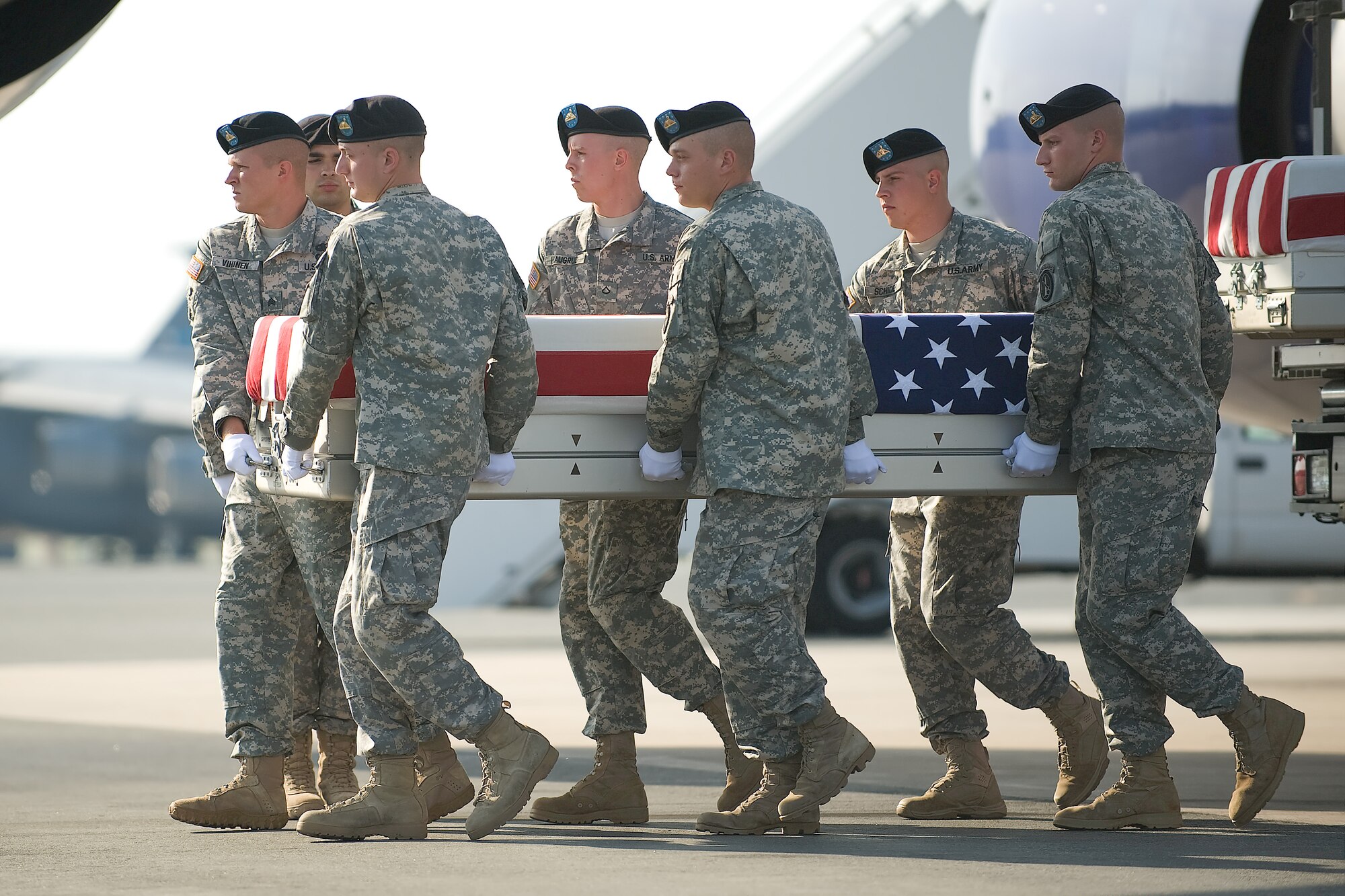 A U.S. Army carry team transfers the remains of Army Sgt. 1st Class Kenneth B. Elwell, of Holland, Pa., at Dover Air Force Base, Del., July 18, 2011. Elwell  was assigned to the 3rd Battalion, 21st Infantry Regiment, 1st Stryker Brigade Combat Team, 25th Infantry Division, Fort Wainwright, Alaska.  (U.S. Air Force photo/Steve Kotecki)