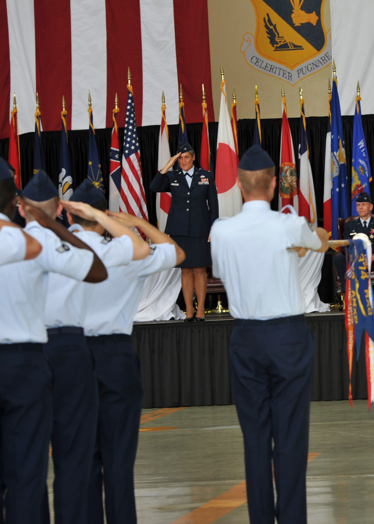 YOKOTA AIR BASE, Japan -- Col. Darlene M. Sanders, 374th Maintenance Group commander, gives her first salute to Airmen during the 374th MXG change of command ceremony at Yokota Air Base, Japan, July 18, 2011. The event is a visible means of handing over the reins of leadership and allows all subordinate Airmen to view their new commander. (U.S. Air Force photo/Senior Airman Andrea Salazar)
