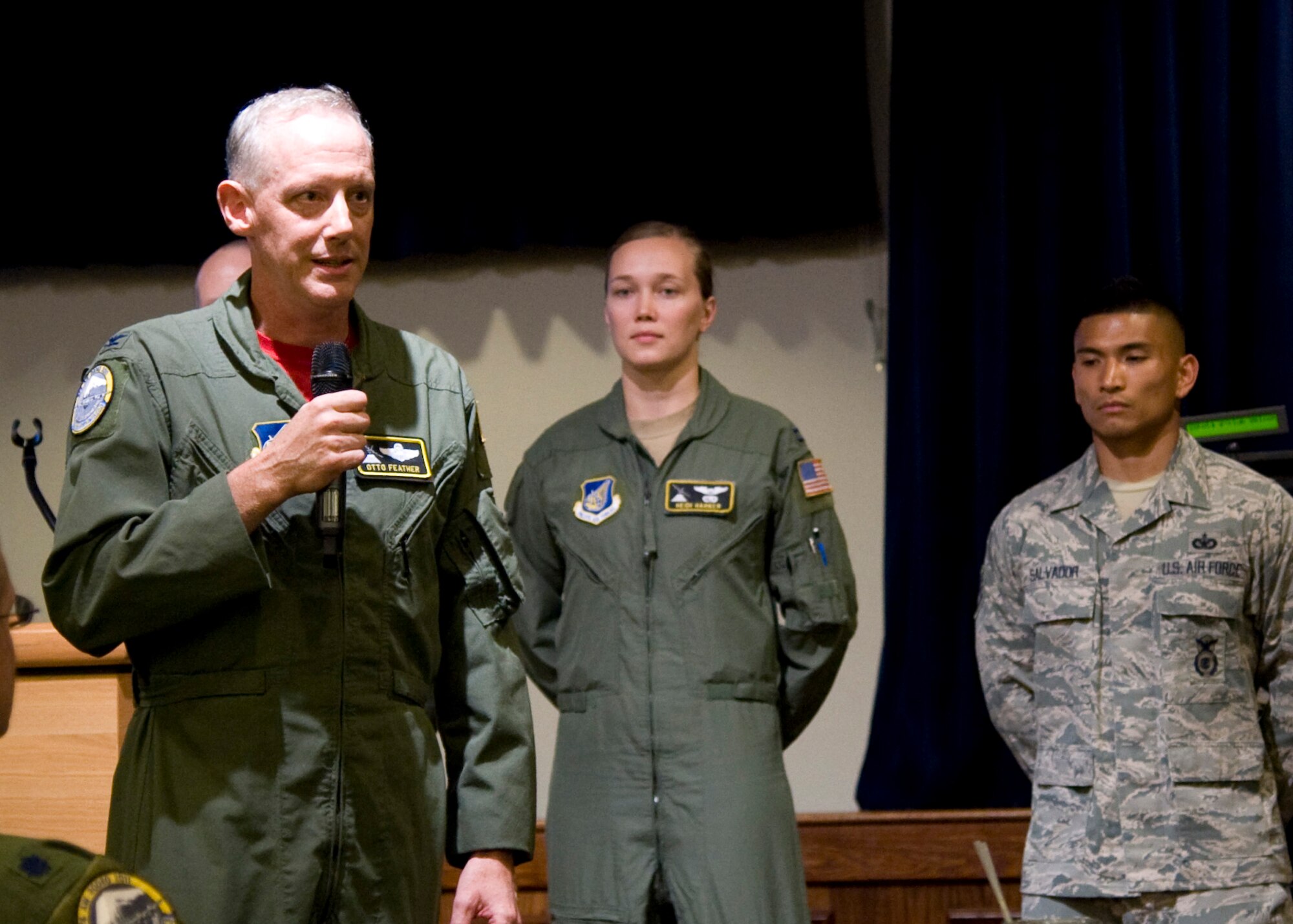YOKOTA AIR BASE, Japan -- Col. Otto Feather (left), 374th Airlift Wing commander, gives a speech during a farewell gathering July 15, 2011, at Yokota Air Base, Japan. The event celebrated Yokota's Airmen participating in the 2011 Air Mobility Command Rodeo taking place at Joint Base Lewis-McChord, Wash., July 23-29. (U.S. Air Force photo/Senior Airman Andrea Salazar)