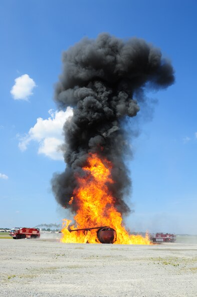 SEYMOUR JOHNSON AIR FORCE BASE, N.C. – A pair of fire trucks from the 4th Civil Engineers Squadron circle a simulated downed aircraft as part of a base wide operational readiness exercise here, July 18, 2011. (U.S. Air Force photo/Senior Airman Rae Perry/RELEASED)