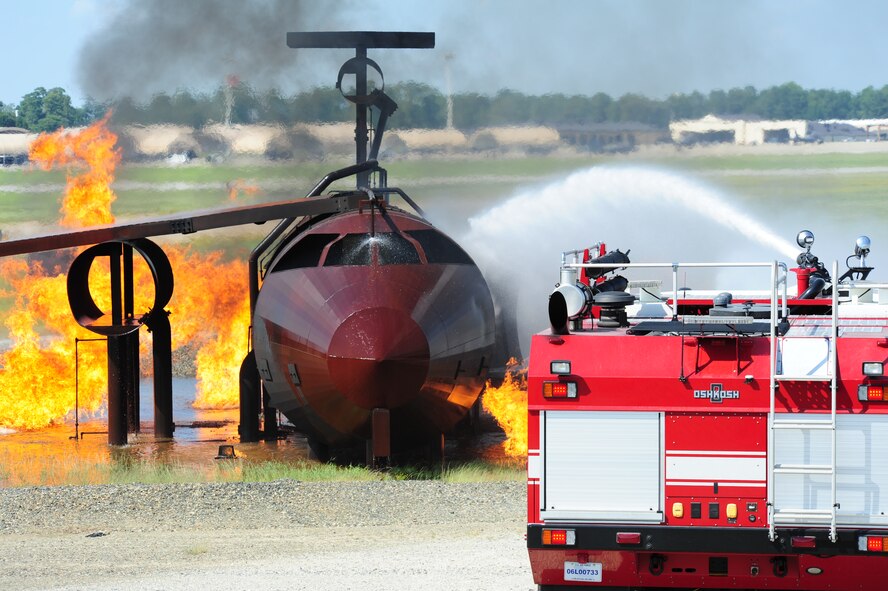 SEYMOUR JOHNSON AIR FORCE BASE, N.C. – A fire crew from the 4th Civil Engineer Squadron work to extinguish flame on a simulated downed aircraft here, July 18, 2011. This exercise was part of a larger scale operational readiness exercise that will run throughout the week. (U.S. Air Force photo by Senior Airman Rae Perry/RELEASED)