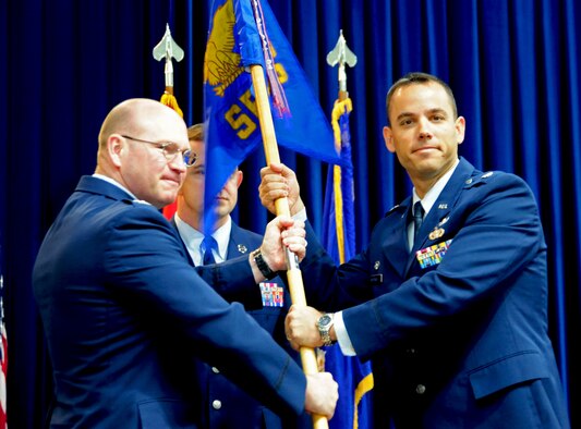 Lt. Col. Brint Woodruff, right, 39th Security Forces Squadron commander, accepts the squadron guidon from Col. Scott Enold, 39th Mission Support Group commander, during the 39th SFS change-of-command ceremony July 18, 2011, at Incirlik Air Base, Turkey. Members of the 39th SFS bid farewell to Lt. Col. Glen Christensen and welcomed Lt. Col. Brint Woodruff as their new squadron commander. (U.S. Air Force photo by Senior Airman Anthony Sanchelli/Released)
