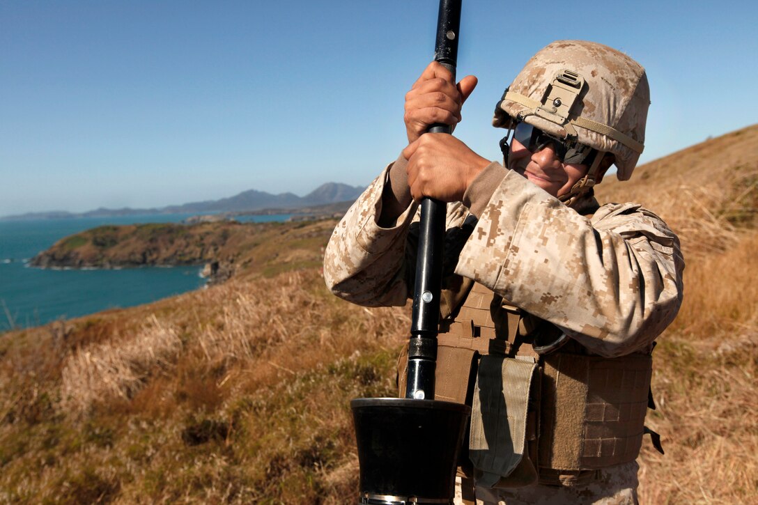 U.S. Marine Lance Cpl. Pendro A. Hernandez cleans the M252 81 mortar system during Talisman Sabre 2011, an exercise on Townshend Island, Australia, July 12, 2011. Hernandez is a mortarman assigned to the 2nd Battalion, 7th Marine Regiment, the 31st Marine Expeditionary Unit's battalion landing team. The exercise demonstrates U.S. and Australian commitment to their military alliance, and enhances stability and security throughout the Asia-Pacific region.
