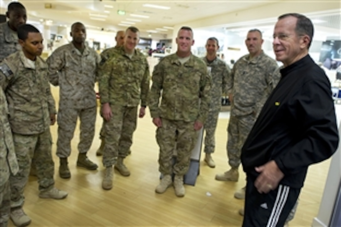 U.S. Navy Adm. Mike Mullen, chairman of the Joint Chiefs of Staff, greets service members at Shannon Airport in Ireland, July 19, 2011. Mullen is returning to the U.S. after completing a 12-day, six-country trip to meet with counterparts and troops in China, Korea and Japan, and to attend the International Security Assistance Force change-of-command ceremony in Kabul, Afghanistan.