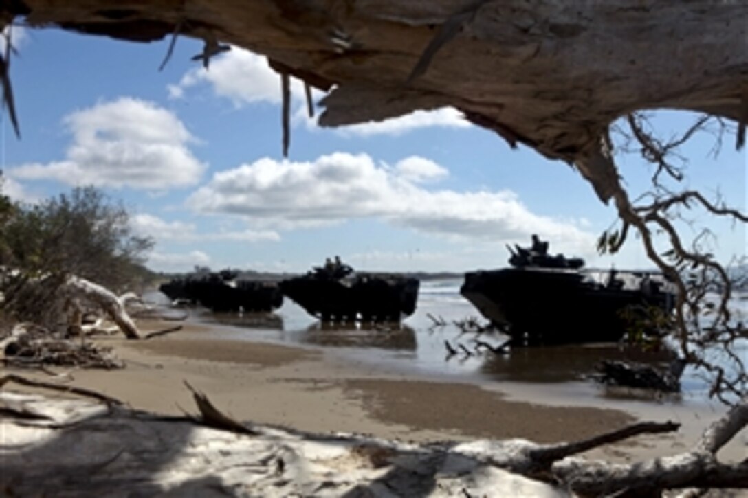 Amphibious assault vehicles land during a mock amphibious assault rehearsal as part of Talisman Sabre 2011, an exercise on Freshwater Beach, Australia, July 18, 2011. About 14,000 U.S. personnel and 9,000 Australian personnel will participate in the exercise, designed in part to enhance stability and security throughout the Asia-Pacific region. The vehicles are assigned to Battalion Landing Team 2nd Battalion, 7th Marines, 31st Marine Expeditionary Unit.