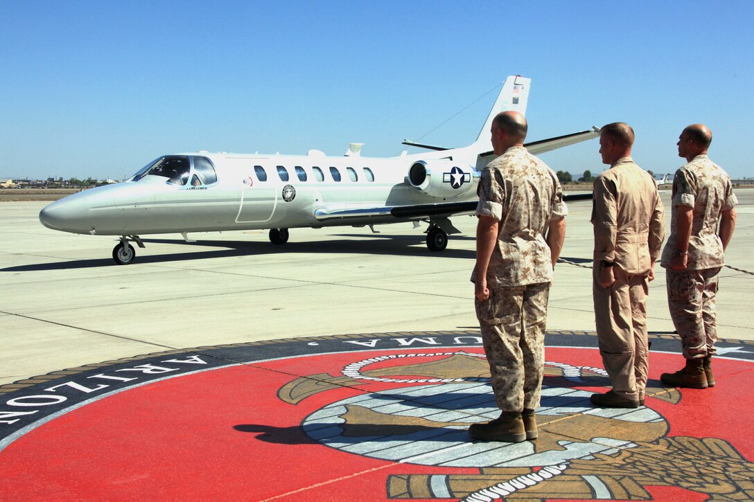 Col. Kevin M. Iiams, the commanding officer of Marine Aircraft Group 41, 4th Marine Aircraft Wing, Col. Robert C. Kuckuk, the commanding officer of headquarters and headquarters squadron in Yuma, Ariz., and Col. Adam T. Holmes, the incoming commanding officer of Marine Aircraft Group 41 come to attention for the arrival of Maj. Gen. Rex C. McMillian, commanding general of the 4th Marine Aircraft Wing. McMillian arrived at the air station to observe and assess Operation Javelin Thrust 2011, the largest reserve training exercise in the Marine Corps.