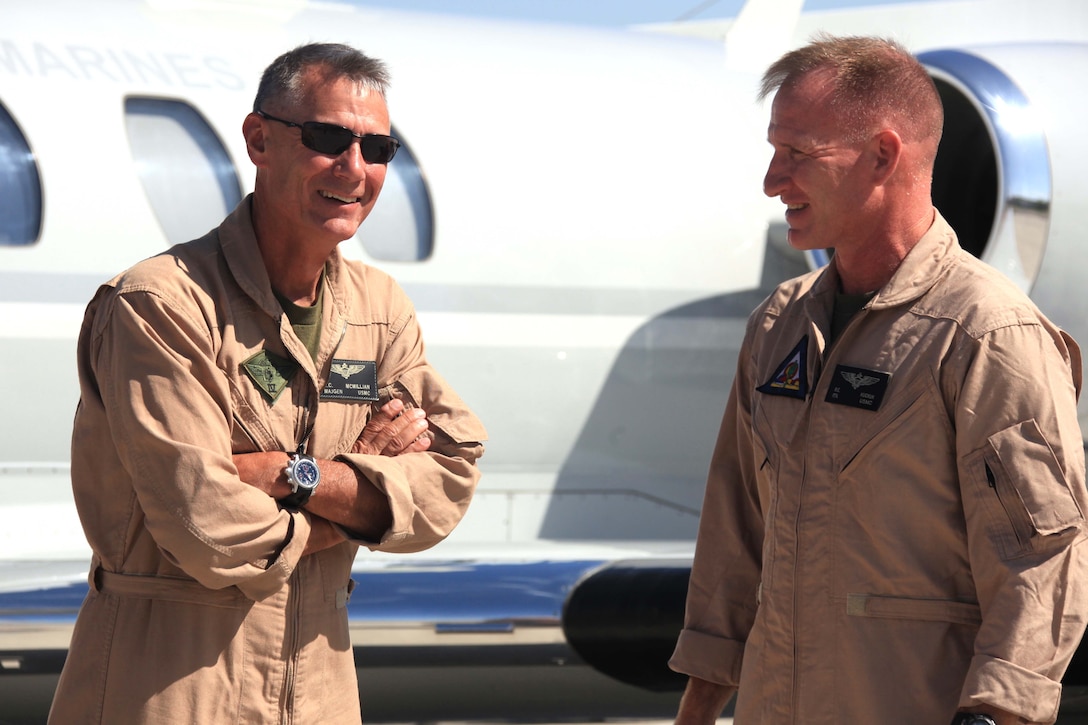 Maj. Gen. Rex C. McMillian, commanding general of the 4th Marine Aircraft Wing talks with Col. Robert C. Kuckuk, the commanding officer of headquarters and headquarters squadron in Yuma, Ariz., July 19. McMillian arrived at the air station to observe and assess Operation Javelin Thrust 2011, the largest reserve training exercise in the Marine Corps.