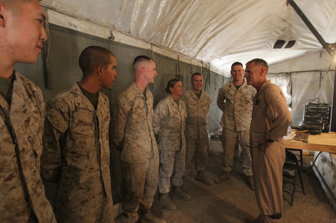 Maj. Gen. Rex C. McMillian, the commanding general of 4th Marine Aircraft Wing, talks with the Marines of Marine Wing Communication Squadron 48 about their mission supporting Operation Javelin Thrust at Marine Corps Mountain Warfare Training Center July 19.