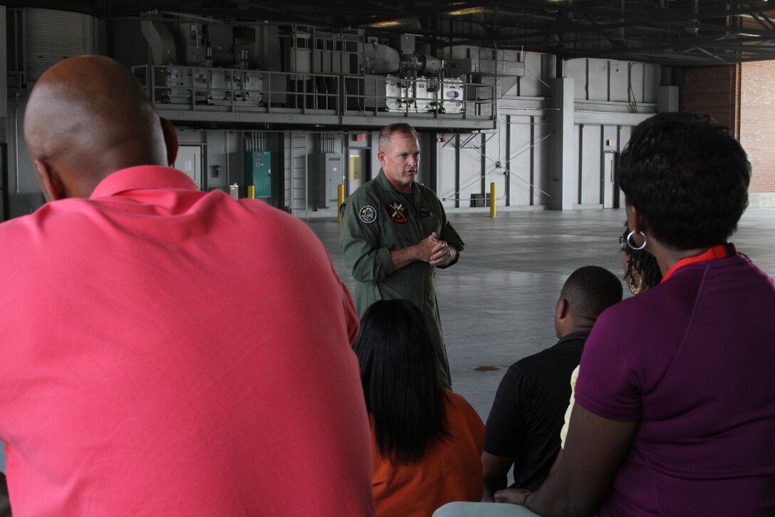 Major Gen. Raymond C. Fox, commanding general, Training and Education Command, speaks to guests on the Key Influencers Workshop at the Marine Corps Air Facility here July 20. The influencers flew on a CH-46 Sea Knight helicopter piloted by Maj. Gen. Fox.