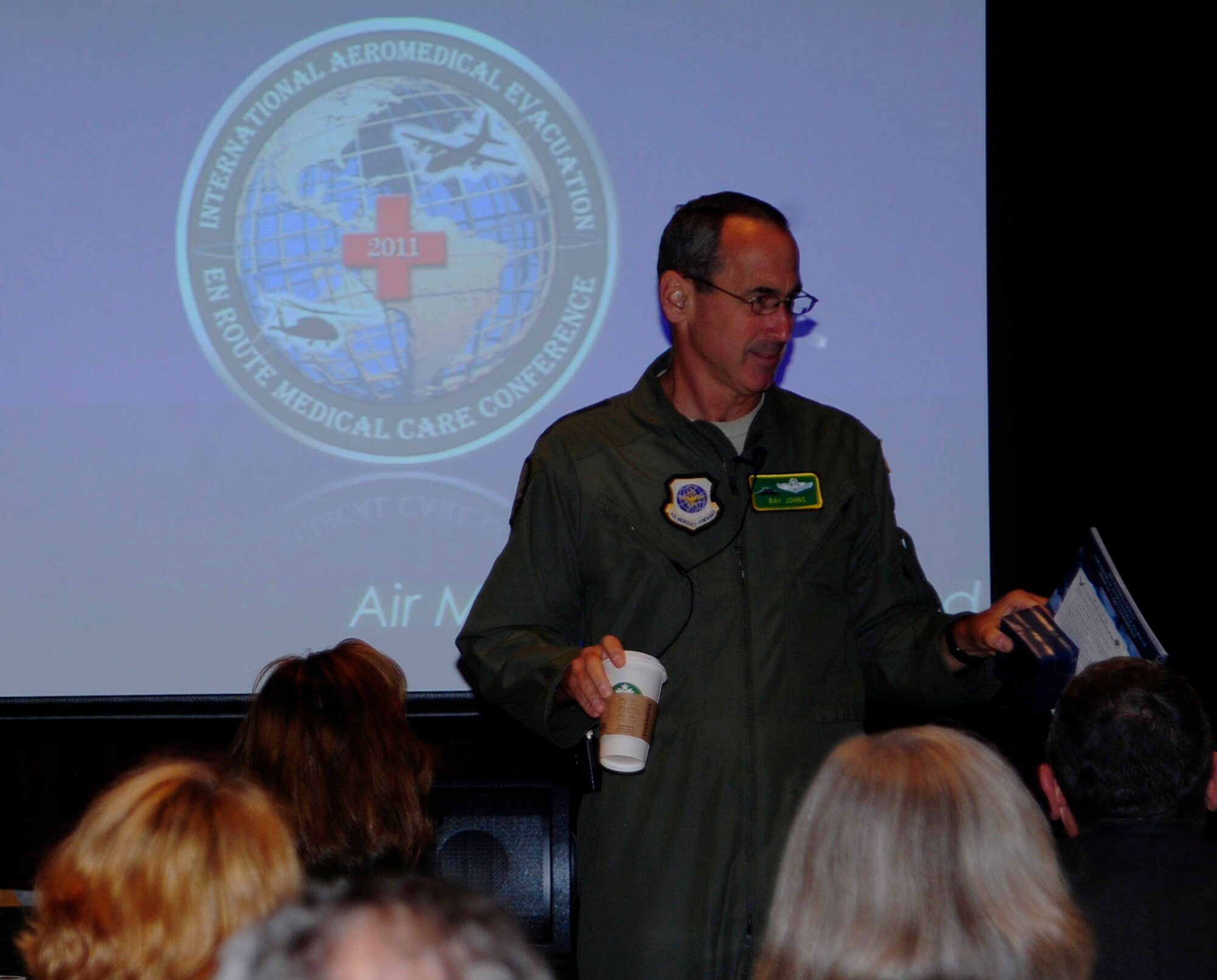 JOINT BASE LEWIS-MCCHORD, Wash. - Gen. Raymond E. Johns Jr. addresses hundreds of medical professionals at the first-ever, U.S.-led international in-flight medical care conference July 20,2011, at Joint Base Lewis-McChord. Johns, the commander of Air Mobility Command, opened the two-day International Aeromedical Evacuation/En Route Care Conference. The event brings together doctors, nurses and paramedics from around the globe to share stories, advice and lessons learned. (U.S. Air Force photo/Staff Sgt. J.G. Buzanowski)