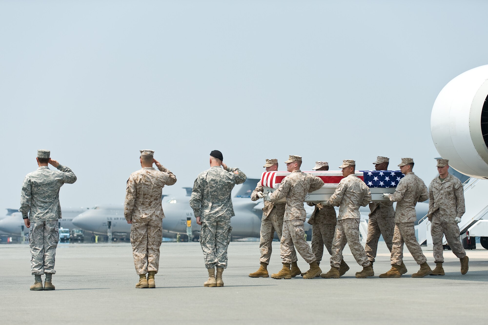 A U.S. Marine Corps carry team transfers the remains of Marine Lance Cpl. Christopher L. Camero, of Kailua Kona, Hawaii, at Dover Air Force Base, Del., July 20, 2011. Camero was assigned to the 3rd Battalion, 4th Marine Regiment, 1st Marine Division, I Marine Expeditionary Force, Twentynine Palms, Calif. (U.S. Air Force photo/Roland Balik)