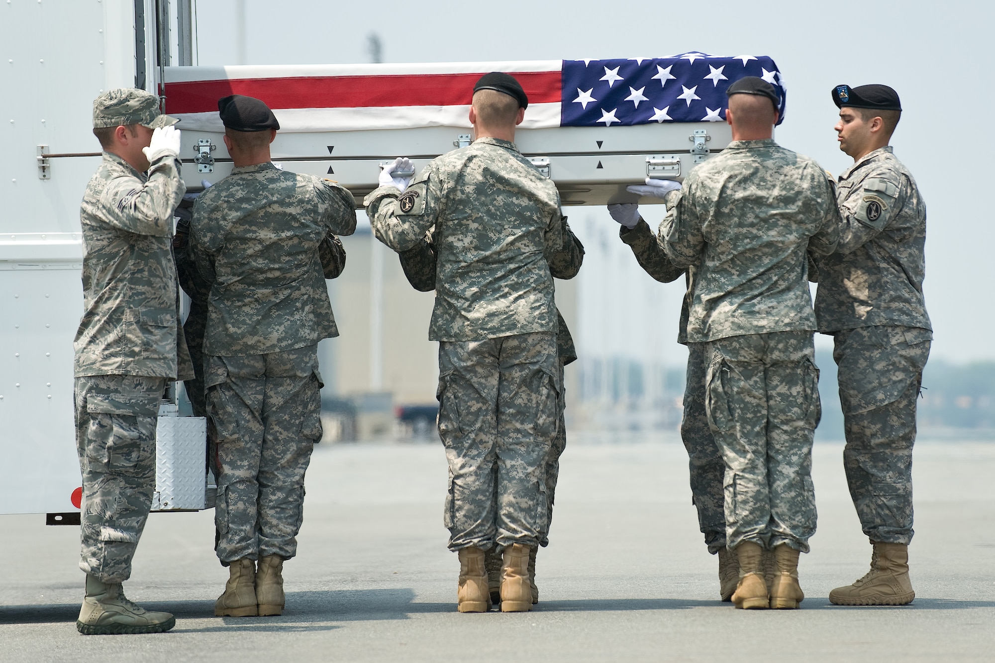 A U.S. Army carry team transfers the remains of Army Staff Sgt. Kenneth R. Vangiesen, of Erie, Pa., at Dover Air Force Base, Del., July 20, 2011. (U.S. Air Force photo/Roland Balik)