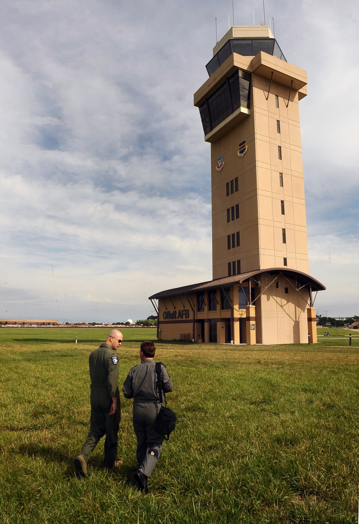 Air Force Maj. Gavin Gigstead, 55th Wing chief of flight safety, walks with Col. Yasar Kadioglu, with the Turkish Air Force, while discussing the different parts of the MERLIN avian radar system, July 12.  The radar system protects incoming and outgoing aircraft from local bird populations that can cause significant damage if they are sucked into an aircrafts engine.  (U.S. Air Force photo by Josh Plueger/Released)