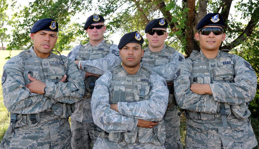 The 22nd Security Forces Squadron  2011 RODEO team, [from left to right] Staff Sergeants William Lagares and Bradon Jones, Senior Airman Melvin Santos, team members, Tech. Sergeant Ryan Overcash, team leader, and Staff Sergeant Robert Bravo, alternate, July 15, 2011, McConnell Air Force Base, Kan.  The team will compete against other Air Mobility Command security forces teams during the AMC RODEO, July 24 to 29, at Joint Base Lewis-McChord, Wash.  (U.S. Air Force photo/ Airman 1st Class Laura L. Valentine)