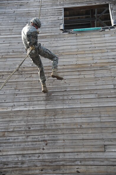 U.S. Air Force Capt. Nicholas Kuc, 820th Combat Operations Squadron chief of communications, repels down a seven-story wall during a demonstration at Moody Air Force Base, Ga., July 20, 2011. The demonstration’s purpose was to show the repelling and fast-roping capabilities of the 93rd Air Ground Operations Wing. (U.S. Air Force photo by Airman 1st Class Paul Francis/Released)
