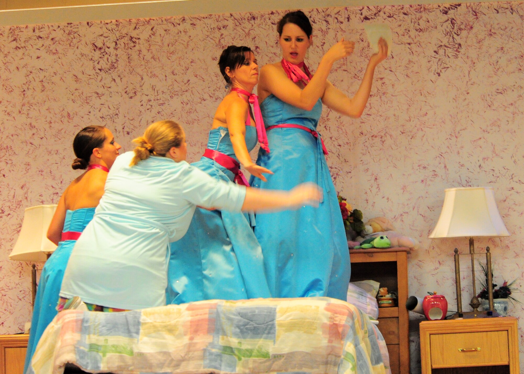 Senior Airman Angela Tracy, Air Forces Central intelligence analyst, Patti Anderson, Michelle Casey and Senior Airman Christine Clucas, 20th Civil Engineer Squadron emergency management flight, run through a scene during dress rehearsal for Shaw Community Theater's production of 5 Women Wearing the Same Dress at the community center here July 19, 2011. The play will be running on July 22 and 23 begining at 7 p.m. (U.S. Air Force photo/ Airman 1st Class Daniel Phelps) (Released)