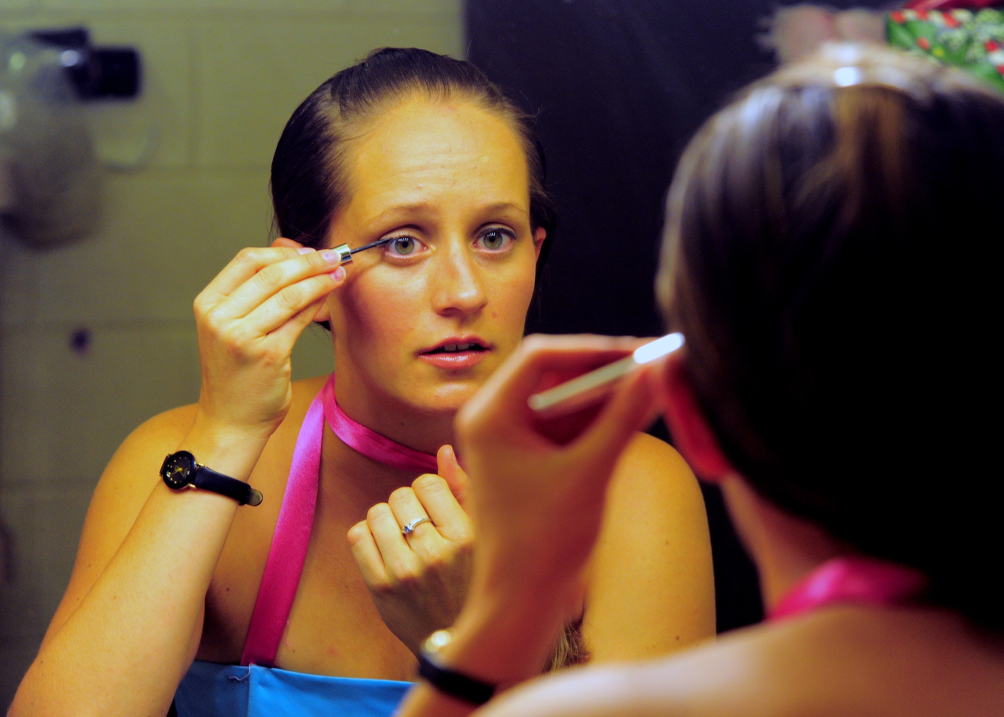 U.S. Air Force Senior Airman Angela Tracy, Air Forces Central intelligence analyst, puts on make up before dress rehearsal for Shaw Community Theaters production of 5 Women Wearing the Same Dress. Tracy is play the role of Frances in the SCT production. (U.S. Air Force photo/ Airman 1st Classs Daniel Phelps) (Released)