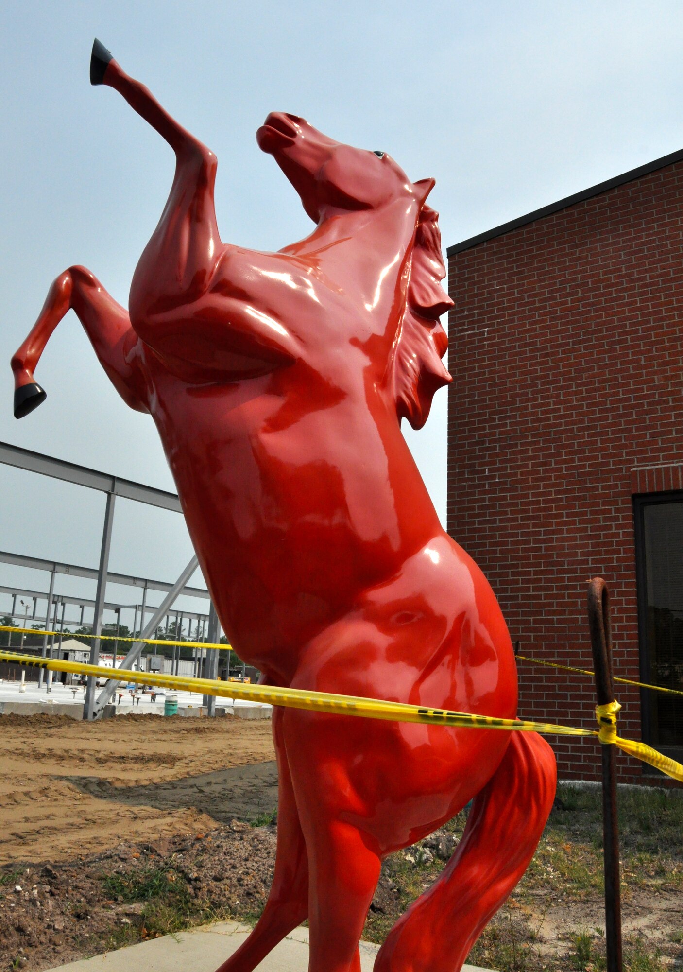The red horse outside the squadron is a tradition within every red horse squadron. The 560th Red Horse Squadron's red horse, along with their red hats, identifies the unit. (Air Force Photo)