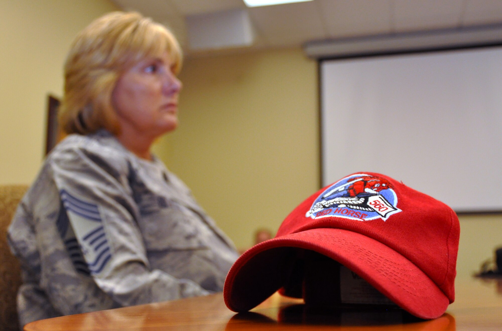 Chief Master Sgt. Tonya Blythe, 560th Red Horse manager, explains what her squadron does to public affairs. The Red Horse squadron does construction in places others can't, and they deploy about every three years with their next deployment in October. (Air Force Photo)