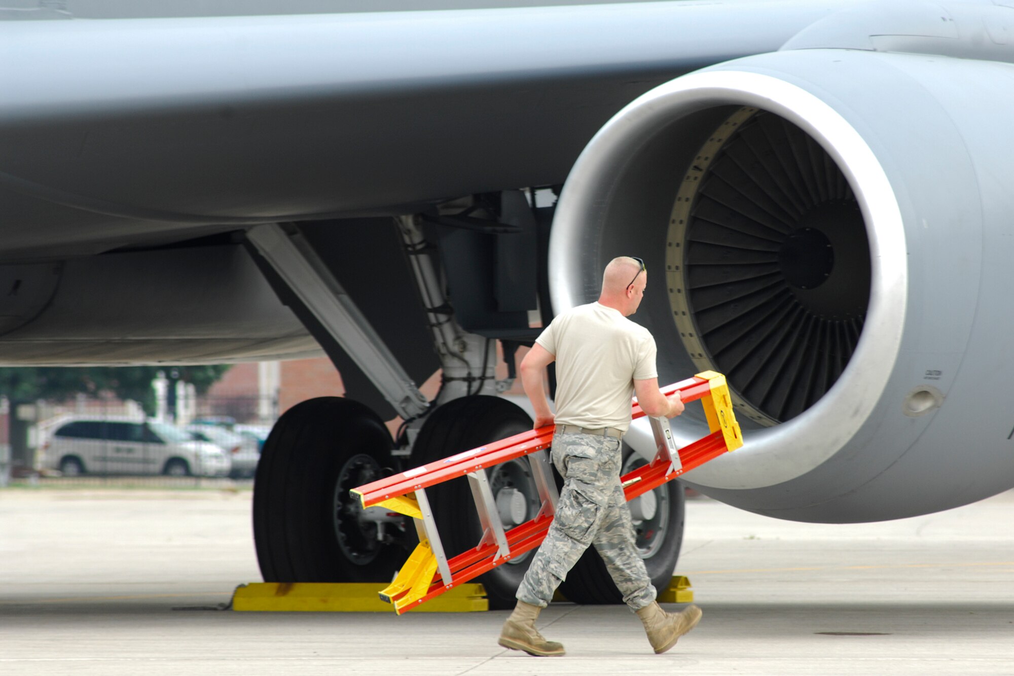 For SSgt. Craig Fenton, an aircraft hydraulics system journeyman with the 191st Maintenance Squadron, work continues on the flightline at Selfridge Air National Guard Base, Mich., on July 20, 2011, as a heatwave rages in the area.  Airmen of the 127th Wing rely on hourly Wet Bulb Globe Temperature readings to determine work/rest cycles and proper water intake for those working in extreme conditions.   "Obviously, anyone working on the flightline is focused on getting that jet out.  It's our responsibility as leaders to ensure the safety of the Airmen out there working," said Maj. David Dominissini, 191st Maintenance Squadron commander. (USAF photo by John S. Swanson)