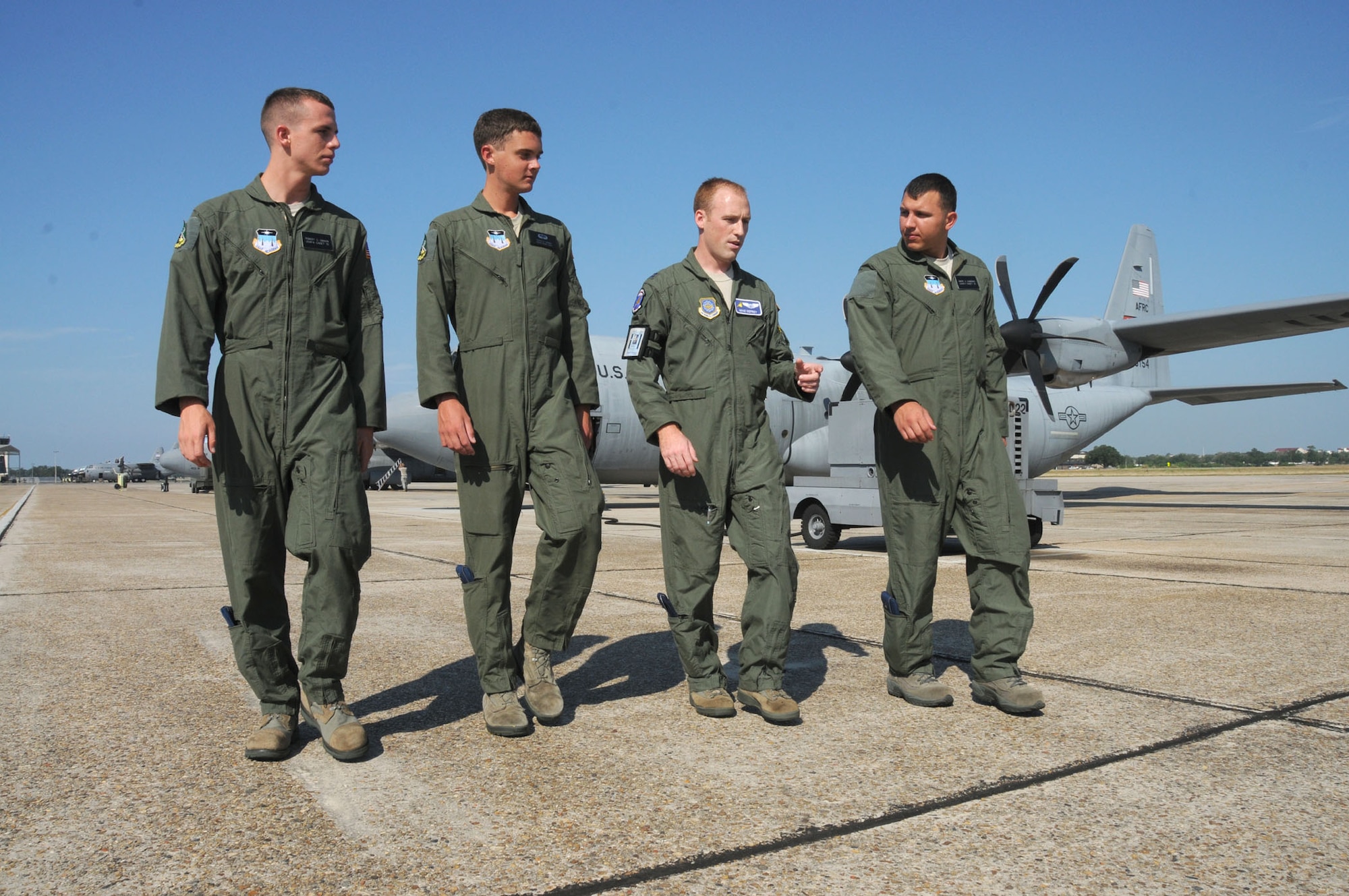 From left, Cadet Robert Gibson, Cadet Joseph Truxal, Capt. Mike Deprey and Cadet Mark Kaminski walk the flightline while Deprey, 345th Airlift Squadron, briefs the Air Force Academy cadets on the duties and responsibilities of being a pilot.  Operation Air Force is an annual program for Air Force Academy students to taste what the operational Air Force is really like.  (U.S. Air Force photo by Kemberly Groue)