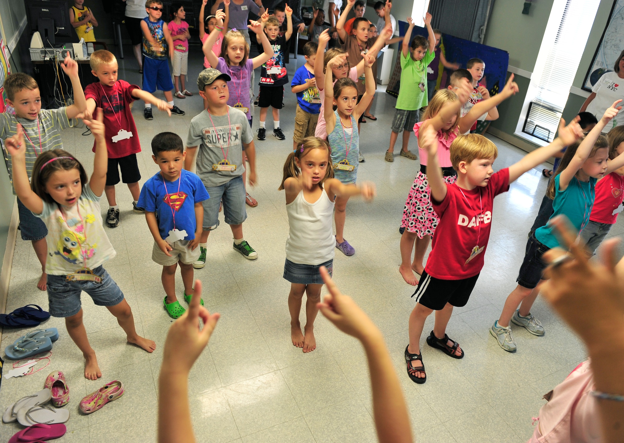 SCOTT AIR FORCE BASE, Ill. -- Kids dance in music class in Chapel 1 during Protestant Vacation Bible School July 13.  VBS took place July 11- 15. This years’ theme was Big Apple Adventure. (U.S. Air Force photo/ Staff Sgt Stephenie Wade)