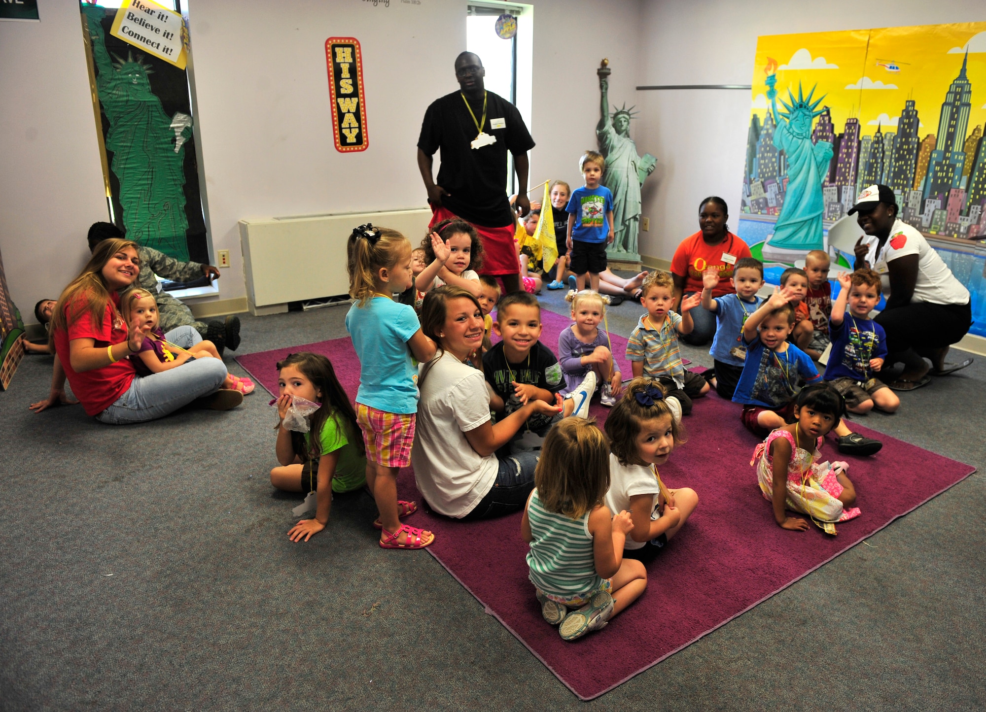 SCOTT AIR FORCE BASE, Ill. -- Children enjoy story time in Chapel 1 during Protestant Vacation Bible School July 13.  VBS took place July 11- 15. This years’ theme was Big Apple Adventure. (U.S. Air Force photo/ Staff Sgt Stephenie Wade)