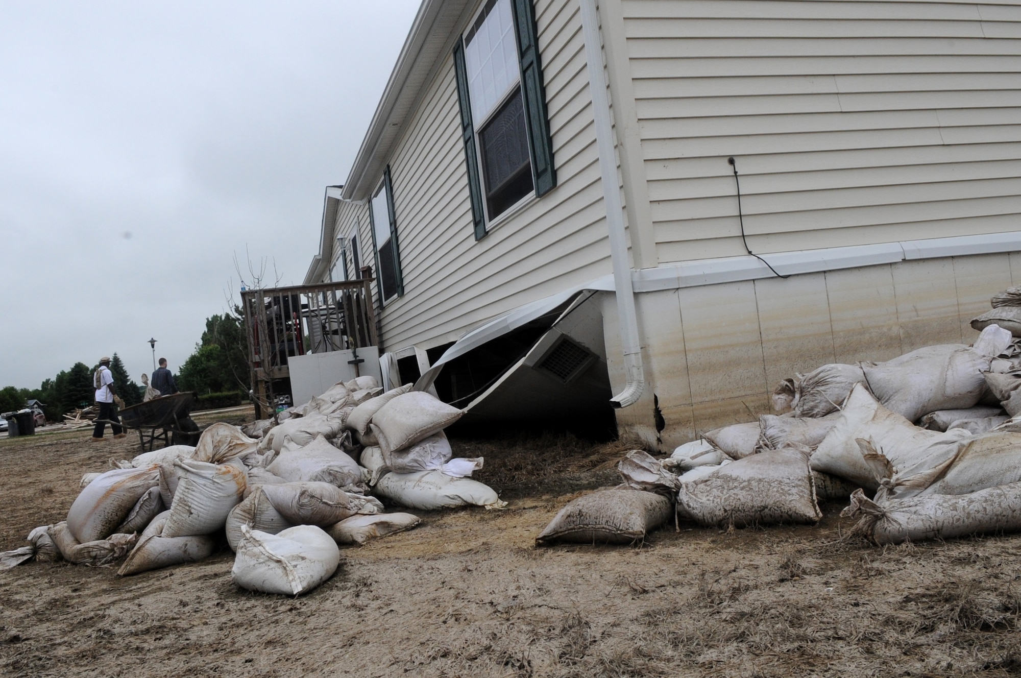 MINOT AIR FORCE BASE, N.D. -- The house here owned by Tech. Sgt. Lance Berentson, 741st Missile Squadron facility manager, was one of the thousands of homes affected by the recent historic flooding situation in Minot. When Berentson and his family were allowed back into their home they noticed their basement was flooded, their house’s foundation damaged and their yard in shambles. (U.S. Air Force photo/Airman 1st Class Jose L. Hernandez)