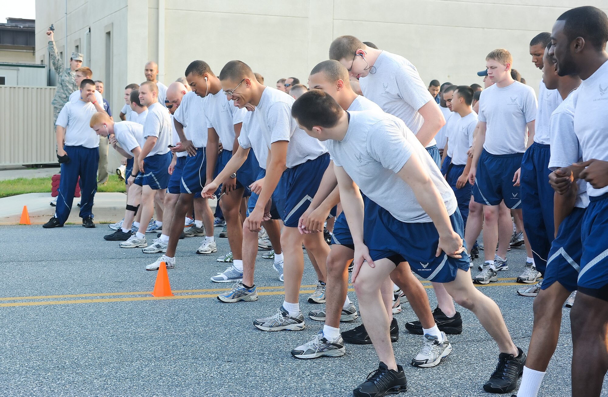 Airmen prepare to begin the Warrior Run July 20, 2011, at Dover Air Force Base, Del. Dozens of Airmen participated in the five-kilometer run, which are held monthly to build morale and emphasize fitness.  (U.S. Air Force photo by Airman 1st Class Samuel Taylor)