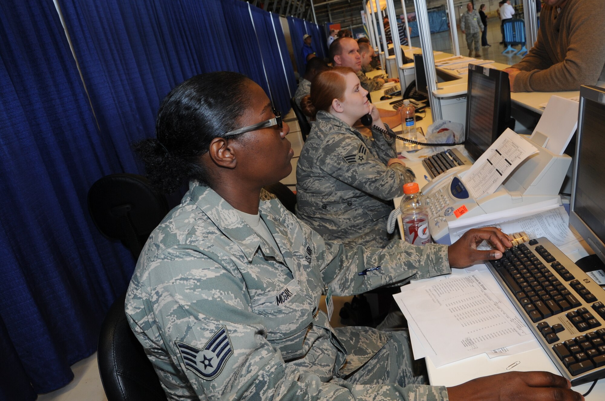 Airmen process through the processing line for Air Mobility Rodeo 2011 at Joint Base Lewis-McChord, Wash., on July 18, 2011. Rodeo is the U.S. Air Force's and Air Mobility Command's premier international combat skills and flying operations competition designed to develop and improve techniques, procedures, and interoperability, while optimizing international mobility  partnerships and enhancing mobility operations. (U.S. Air Force Photo/Tech. Sgt. Christine Jones)