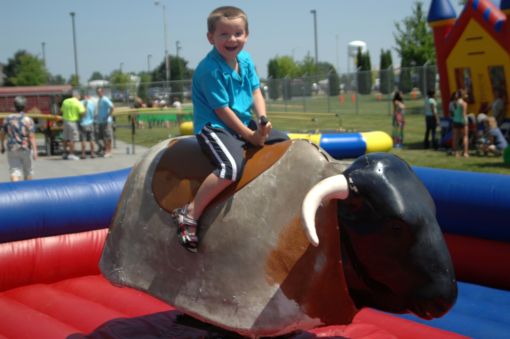 GRISSOM AIR RESERVE BASE, Ind. -- Families of Grissom reservist attended Family Appreciation Day during the July primary unit training assembly. Families were able to participate in a variety of activities, competitions and games. Here a child of a reservist rides a mechanical bull. (U.S. Air Force photo/Staff Sgt. Carl Berry)