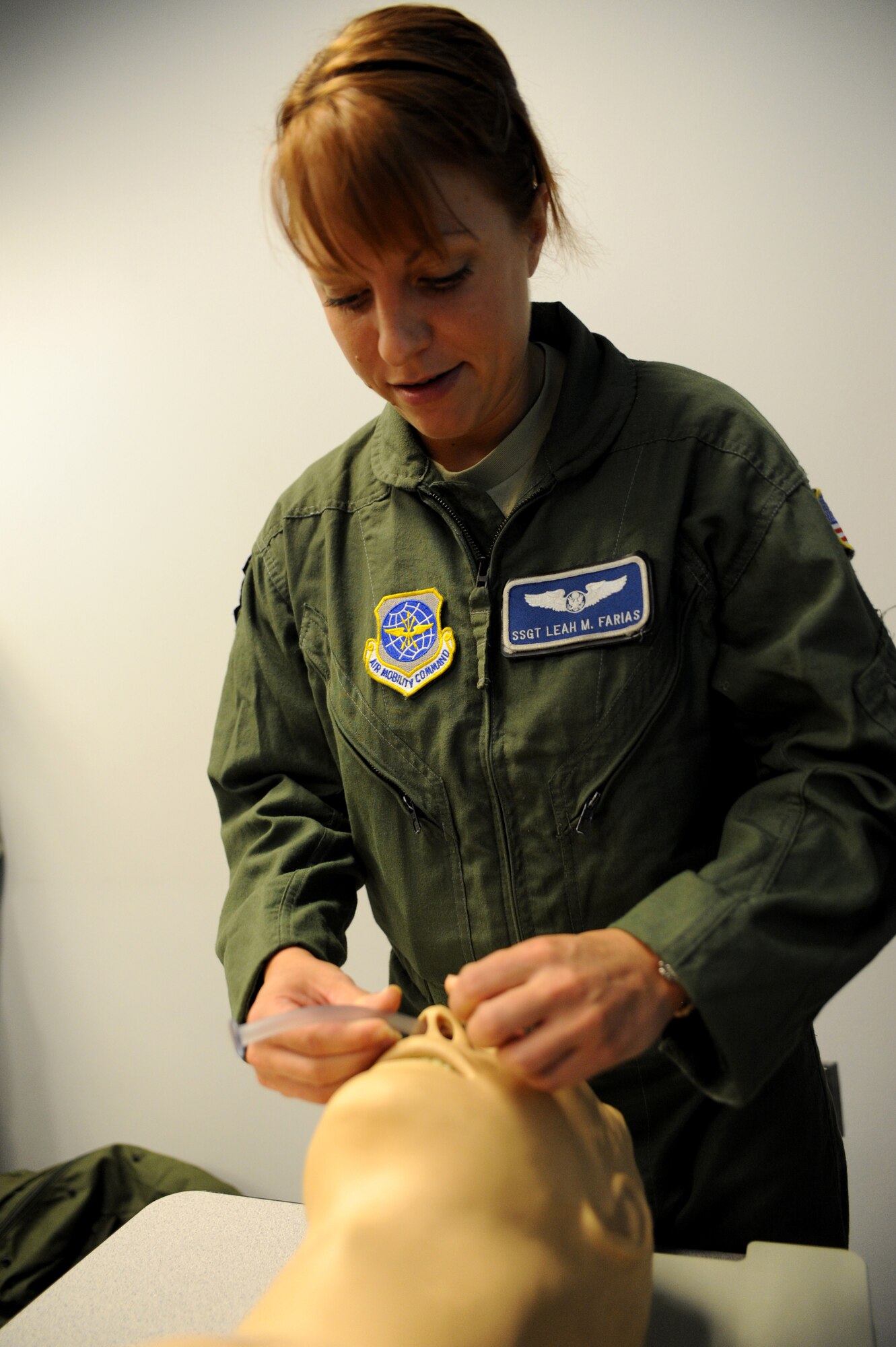 Staff Sgt. Leah Farias practices inserting a nasopharyngeal tube during the Self Aid Buddy Care portion of the circuit training  July 19 at Joint Base Charleston, S.C. The 628th Logistics Readiness Squadron hosts the circuit training which includes Self Aid Buddy Care, small arms training and chemical, biological, radiological, nuclear and high-yield explosives training. The circuit training is designed to prepare Airmen for the upcoming Operational Readiness Exercise.Farias is a loadmaster assigned to the 17th Airlift Squadron.  (U.S. Air Force photo/ Staff Sgt. Nicole Mickle)  