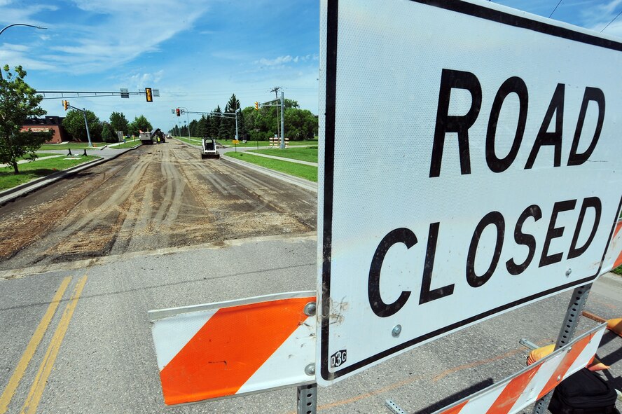 MINOT AIR FORCE BASE, N.D. – Contractors repair pot holes and reconstruct the road along Missile Avenue, here July 18. This project will improve the roads on base as well as add a turning lane to relieve the traffic surrounding the shoppette. (U.S. Air Force Photo/ Senior Airman Jesse Lopez)