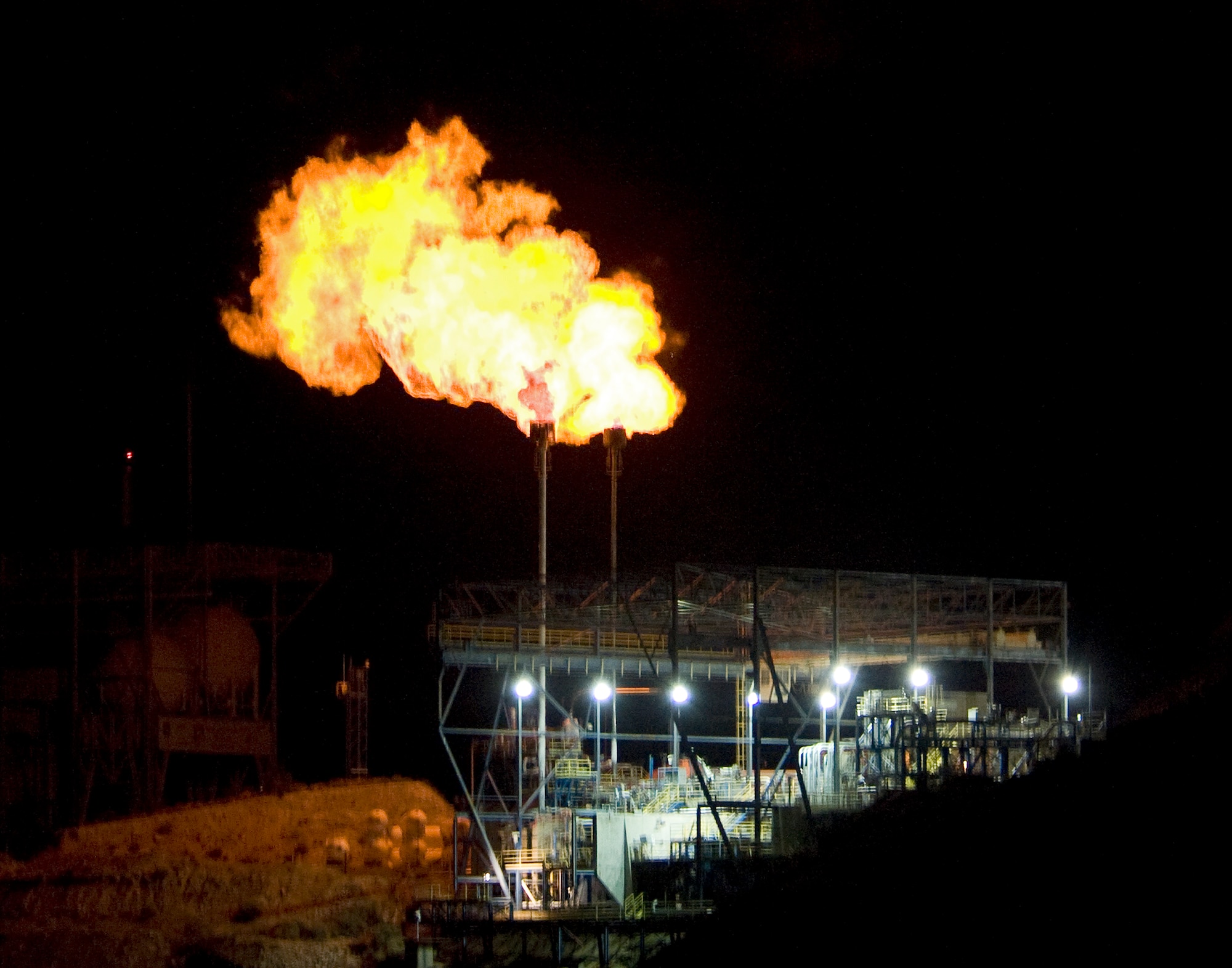 High-pressure hydrogen, in the form of flames, is expelled from a turbopump, July 12 as part of the Upper Stage Engine Technology test series at the Air Force Research Laboratory, Propulsion Directorate, Detachment 7 at Edwards. Just one of many Edwards rocket test programs, the USET turbopump is the most recent stage of rocket testing. The testing involves developing physics-based modeling and simulation tools to design components of upper stage rocket engines. Modernized methods of design and testing will help reduce the amount of time and cost that goes into developing rocket engines. (Air Force photo by Ron Fair)