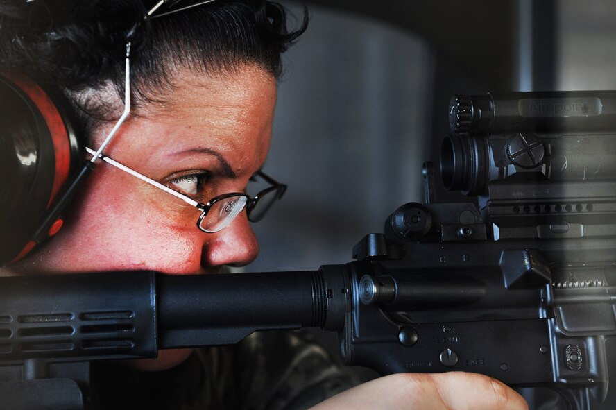 U.S. Master Sgt. Cynthia Cruz, 20th Force Support Squadron manpower superintendent, aims at her target during the Combat Arms Training and Maintenance class here at the small arms training range July 19, 2011. Airmen take the CATM class as a requirement for deployments, Permanent Change of Station, or training. (U.S. Air Force photo/Airman 1st Class Tabatha L. Duarte) (Released) 