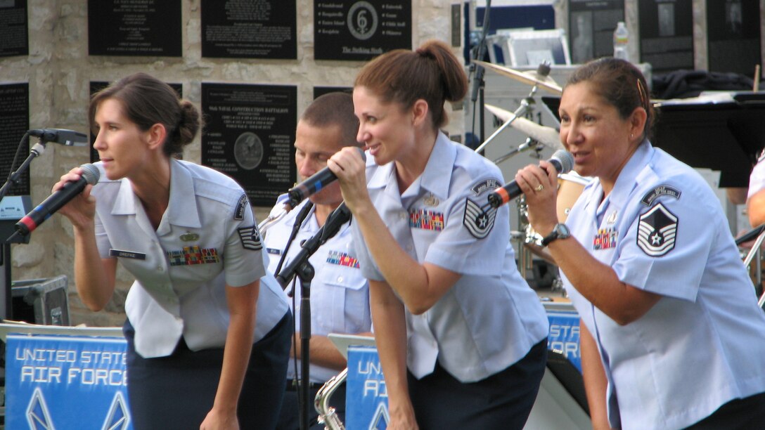 TSgt Lisa Drefke, TSgt Christin Foley and MSgt Rosemary Castillo-Sartin perform with Dimensions in Blue in Fredericksburg, TX on July 8, 2011