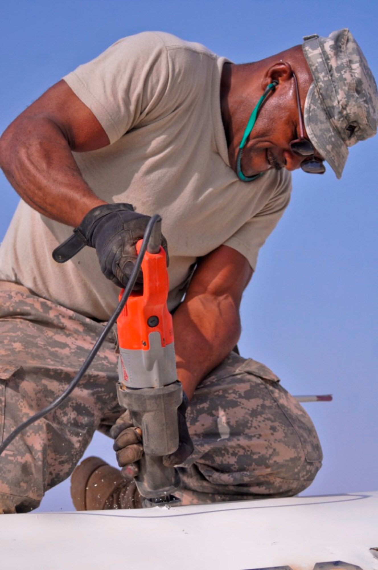 Sgt. Ronald Brown, a machinist with the 1729th Forward Support Maintenance Company, 749th Combat Sustainment Support Battalion, 4th Sustainment Brigade, 310th Expeditionary Sustainment Command, and an Aberdeen Proving Grounds, Md., native, saws at a C-21 transportation jet during a downed aircraft recovery team training exercise on Contingency Operating Base Adder, Iraq, July 15. (Photo by Staff Sgt. Jason Thompson)