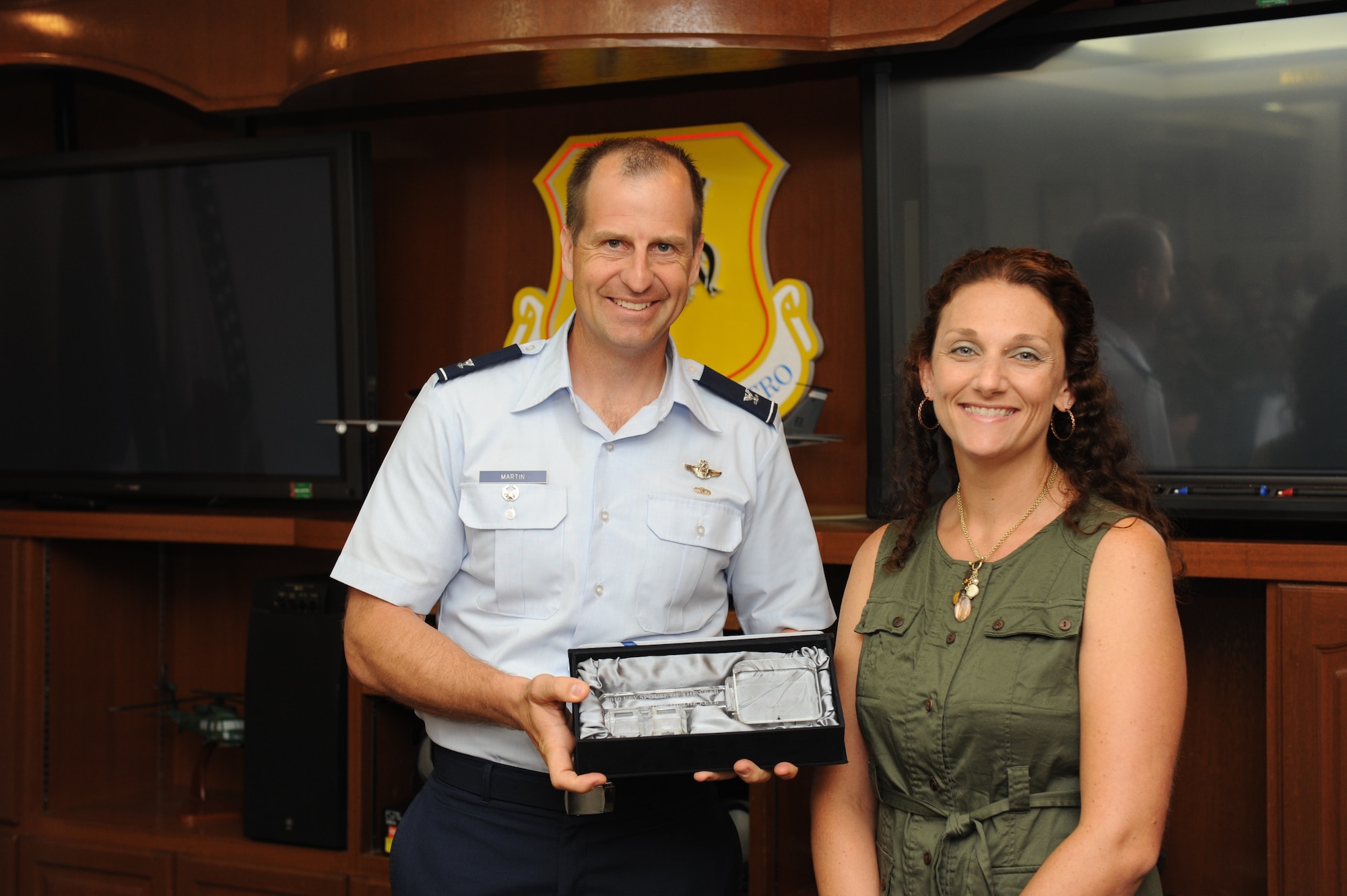 Joanna Urban receives her Key Spouse award from Col. Corey Martin, 18th Wing vice commander, June 20. Urban was named Pacific Air Forces Key Spouse of the Year for her unwavering dedication to the mission and families of the 18th Security Forces Squadron. (U.S. Air Force photo/ Airman 1st Class Brooke P. Beers)

