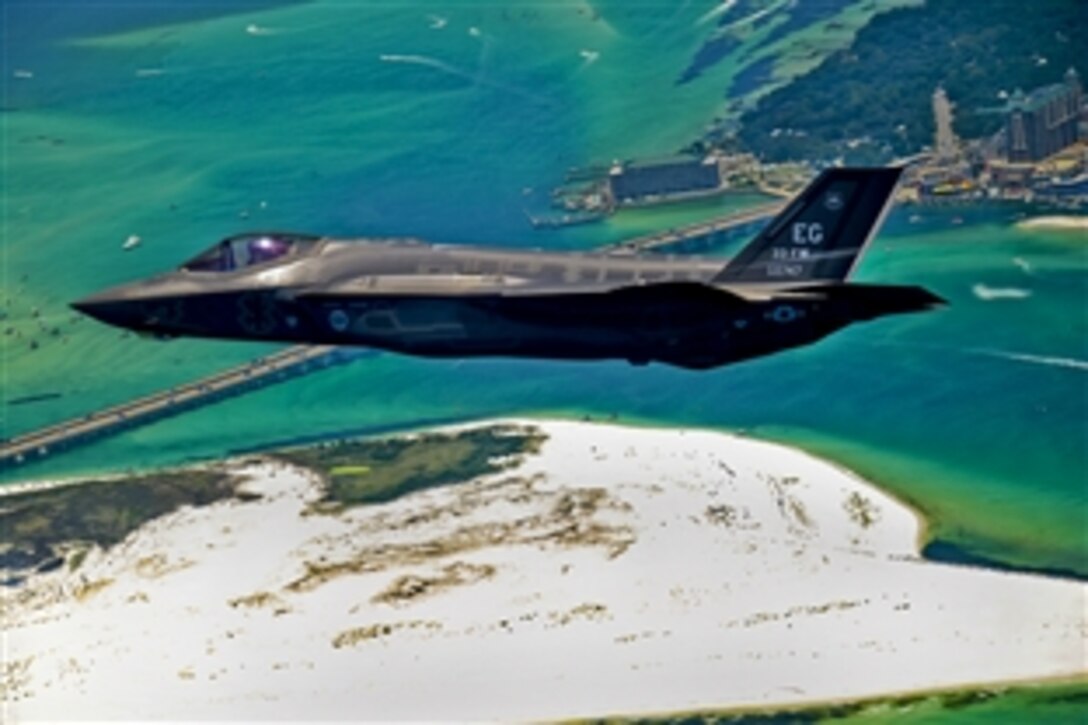 The Defense Department's first U.S. Air Force F-35 Lightning II joint strike fighter aircraft soars over Destin, Fla., before landing at its new home at Eglin Air Force Base, July 14, 2011. Its pilot, Lt. Col. Eric Smith, assigned to the 58th Fighter Squadron, is the first Air Force qualified pilot for the aircraft.